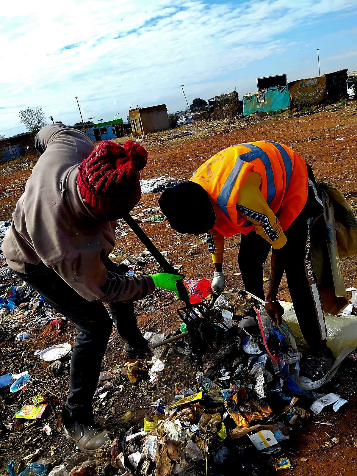 Soweto community members participating in community cleanup programs